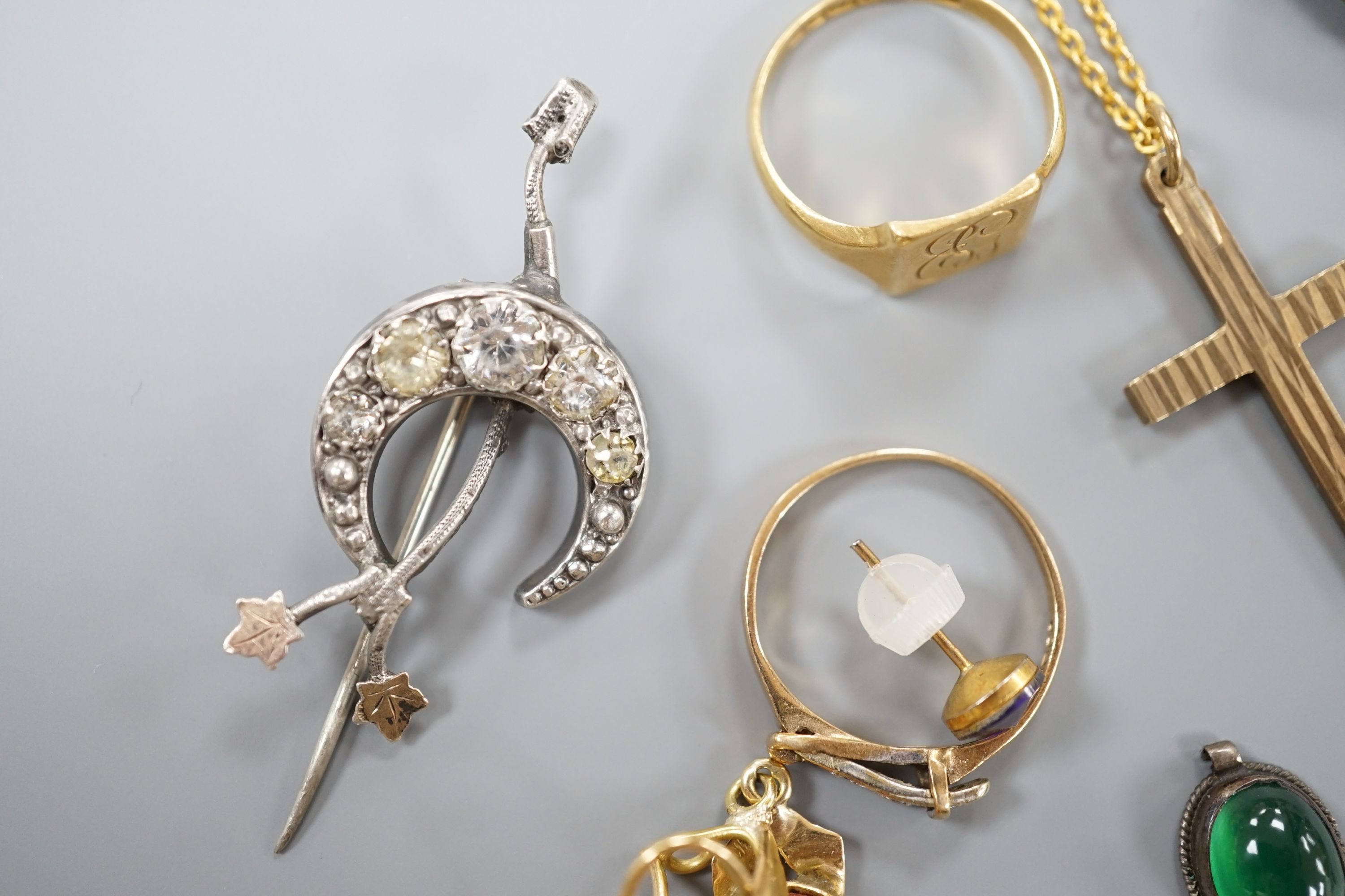Assorted small jewellery including two 9ct rings, a 9ct cross pendant on a gilt metal chain, (9ct 5.3 grams), and 18ctgold signet ring, 2.5 grams, a 14k pendant. gross 2.2 grams, a continental yellow metal pendant and ri
